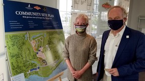 Sales rep Sharon Johnston and Rob McLeese, a founder of the Cobble Beach golf restort community, in the real estate centre Saturday, Sept. 12, 2020 in Georgian Bluffs. (Scott Dunn/The Sun Times/Postmedia Network)