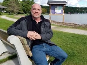 Corey Phair sits in Bluewater Park on Friday, Sept. 4, 2020, where a confluence of events inspired him to get clean. He's been off drugs for two years and has shared his story on a health unit webpage . (Scott Dunn/The Sun Times/Postmedia Network)