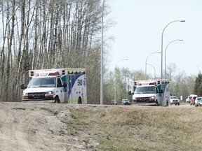 Ambulances on Highway 881 between Gregoire Lake and Anzac, Alta., south of Fort McMurray, on Wednesday May 4, 2016. Ian Kucerak/Postmedia Network