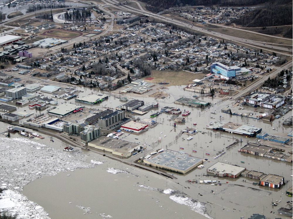 Berms withstood April's flooding, manholes outside berm spread water Fort Mcmurray Today
