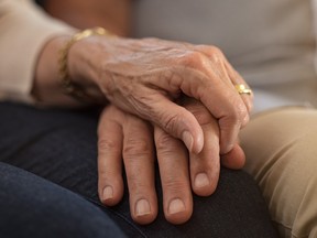 Senior couple holding hands