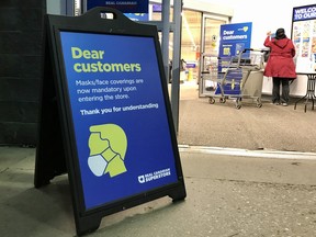 A sign notifying customers at Real Canadian Superstore that the business has a mandatory mask rule on Sept. 13, 2020. Vincent McDermtt/Fort McMurray Today/Postmedia Network