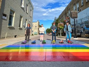 Organizers of a rainbow crosswalk project in Kincardine stand with the new feature on Harbour Street. Pictured, from left to right, are: Ashley Richards, director of the Kincardine & District Chamber of Commerce; Siobhan Farrell, member of Kincardine's arts, culture and heritage committee; Michael Yun, chair of the arts, culture and heritage committee; and Rick Clarke, downtown development manager for the Kincardine BIA. SUPPLIED