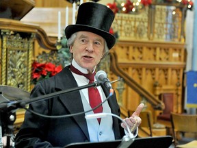 Canada's first prime minister, Sir John A. Macdonald, aka Brian Porter, counts down the final seconds at a New Year's Eve concert on, Dec. 31, 2016, in Brockville, Ont.