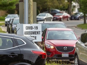 Long lineups on Valetta Street wait for the chance to be tested at the Oakridge COVID-19 Assesment Centre in London. (Mike Hensen/The London Free Press)