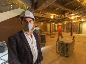 Grand Theatre artistic director Dennis Garnham stands in the downstairs McManus Theatre lobby on Wednesday as the Grand is under renovation this season while closed due to COVID-19.(Mike Hensen/The London Free Press)