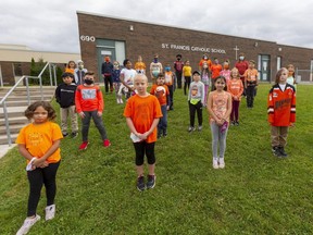 Students from the Grade 4 class at St. Francis Catholic elementary school in London are pictured Wednesday on Orange Shirt Day, an annual effort intended to remember the awful history of residential schools here and across Canada. Photograph taken on Wednesday September 30, 2020. Mike Hensen/The London Free Press