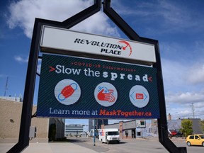 A digital sign displays tips for preventing the spread of COVID-19 in front of Revolution Place in Grande Prairie, Alta. on Saturday, Aug. 29, 2020. This is part of a jointly funded information campaign between the City and County of Grande Prairie.
