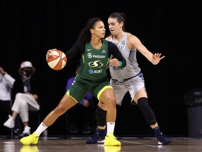 Alysha Clark (32) of the Seattle Storm posts up on Bridget Carleton (6) of the Minnesota Lynx in Game 2 of their semifinal in the 2020 WNBA playoffs on September 24, 2020, at Feld Entertainment Center in Palmetto, Fla. Copyright 2020 NBAE (Photo by Ned Dishman/NBAE via Getty Images)