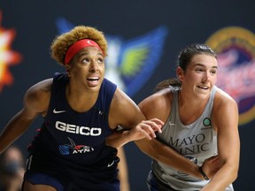 Bridget Carleton, right, of the Minnesota Lynx fights for position with Tianna Hawkins of the Washington Mystics on Sept. 8, 2020, at Feld Entertainment Center in Palmetto, Fla. Copyright 2020 NBAE (Photo by Stephen Gosling/NBAE via Getty Images)