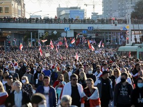 Opposition supporters march during a rally to demand the resignation of Belarusian President Alexander Lukashenko on Sunday, more than a month after the disputed presidential election, in Minsk, Belarus. (BelaPAN via REUTERS)