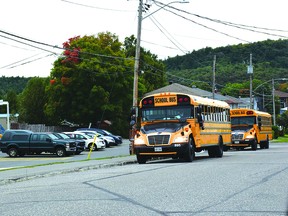 Photo by KEVIN McSHEFFREY

Buses rolled up to schools in Elliot Lake and across the region Tuesday morning. Here buses were stopped at Central Avenue Public School in Elliot Lake where staff was waiting for them.