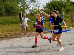 Jacinda Riley, left, and Ann Elford cross the finish line in their virtual Boston Marathon Saturday, Sept. 12, 2020 in Owen Sound, Ont. (Scott Dunn/The Sun Times/Postmedia Network)