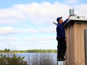 Quinte Conservation's drought project coordinator, Mark Boone, installs a rain gauge at Deerock Lake Conservation Area north of Flinton. The conservation authority is now gathering public input for the project's draft plan for drought management.