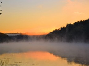 Mist rises from the Moira River as the sun breaches the horizon in Thurlow. The fall forecast is calling for "above seasonal" temperatures this autumn with high-pressure systems dominating the province making weekend outdoor pursuits much more pleasant amid a fall kaleidoscope of coloured leaves. 
W. BRICE MCVICAR