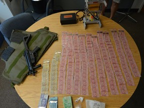 Police seized 39.1 grams of cocaine, 4.9 grams of crystal methamphetamine, Canadian currency totaling $12,175, a bullet proof vest, a replica firearm, a cocaine press, and hydromorphone pills during a Project Renewal operation in Belleville Wednesday.
SUBMITTED PHOTO