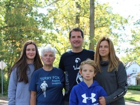 The Porteous family -- Andrew,  wife Anita, mother Jan and children Zoie and Carson -- walk through their Brantford neighbourhood on Sunday, marking the first-ever virtual Terry Fox Run.