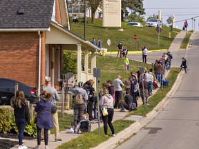 Hundreds of people were lined up down the Elizabeth Street hill adjacent to Brantford General Hospital late Tuesday morning, waiting for a COVID-19 test at the hospital's assessment centre.