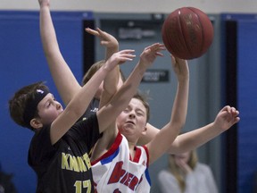 Nate Vanderlaan (centre) of the Brantford Briers vies for the ball during the 2018 Paul Mitchell Invitational basketball tournament. The Brantford-based club is running skills and drills type sessions for groups of young players. Expositor file photo