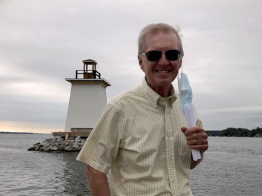 Former senator Bob Runciman stands on a boat as it passes by the Five Mile Light on Tuesday afternoon. (RONALD ZAJAC/The Recorder and Times)