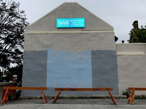 The wall of the Brockville Tourism building on Market Street West has been prepared for a mural, the fate of which is uncertain as council debates the future of the tourism service. (RONALD ZAJAC/The Recorder and Times)