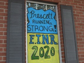 Windows at Irving H. Miller Insurance on King Street West in downtown Prescott promote the upcoming Fort Town Night Run. The event has now been cancelled.
(FILE PHOTO)