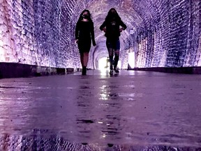 TUNNEL TO CLOSE ON FRIDAY
Shivani Jagota, left, and Gagan Sandhu, from Toronto, take a walk in the Brockville Railway Tunnel on Monday afternoon. City hall on Monday announced the tunnel will close for the season at 9 p.m. Friday, due to the worsening COVID-19 situation. (RONALD ZAJAC/The Recorder and Times)