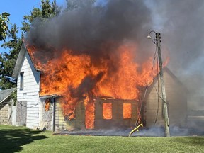 Chatham-Kent firefighters put out these flames at an abandoned house on Bear Line Road in Chatham, Ont., on Friday, Sept. 4, 2020. (Chatham-Kent Fire Department Photo)