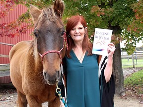 Sharon Campbell-Rayment is pictured with her horse Malachi, a Rocky Mountain breed, near Kent Bridge, Ont. in this file photo taken October 26, 2016 after the release of her book 'Falling into the Rhythm of Life: Life Lessons Straight from the Horse's Mouth. Malachi has been missing since early Saturday which has resulted in local residents helping the search including using drones and airplanes. Ellwood Shreve/Chatham Daily News/Postmedia Network