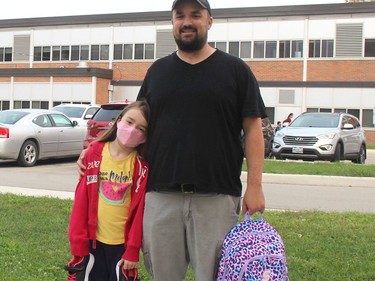 Brooklynn Arnold, 7, seen her with her dad Jim is excited about making new friends on her first day attending Tecumseh Public School in Chatham, Ont. on Thursday September 10, 2020. Ellwood Shreve/Chatham Daily News/Postmedia Network