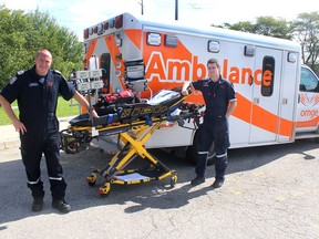 Ornge paramedics Andrew Whittemore, left, and Jesse Schneider, have been busy transporting area critical patients, which keeps medical staff in hospital, while working out of a temporary critical-care ambulance base located at the Chatham-Kent EMS headquarters in Chatham. (Ellwood Shreve/Chatham Daily News)