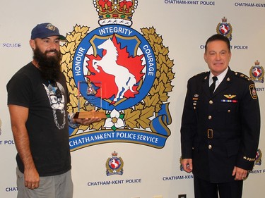 Kevin Moore, left, of Chatham received a Chatham-Kent Police Services Board Citation from Chief Gary Conn during Tuesday's board meeting for his efforts to save a man who was attempting suicide. Ellwood Shreve/Chatham Daily News/Postmedia Network