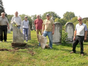 The ongoing work of repairing and uprighting heritage grave markers in Chatham-Kent continues this week thanks to the dedication of volunteers with the Chatham-Kent Cemetery Restoration Project. Seen from left are volunteers Les Mancell, Bruce Warwick, Peggy O'Rourke, Tom Moore, Tom Mallard and Collin Mardling, supervisor of Chatham-Kent cemeteries as restoration work took place at Maple Leaf Cemetery in Chatham on Tuesday. (Ellwood Shreve/Chatham Daily News)