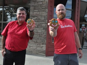 Local Tim Hortons franchisees Nelson Matos, left, and Darryn McPhail were hard at work on Monday September 14, 2020, decorating cookies for the Smile Cookie campaign. The fundraiser, which will raise money for the Boys and Girls Club of Cornwall and SDG, runs from Sept. 14-20.  Francis Racine/Cornwall Standard-Freeholder/Postmedia Network