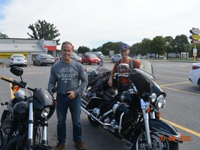 Bob Kikkert and his son Todd, during a stop in the Ride Together Alone effort, the photograph taken by Earle DePass, the third member of the small group that has raised over $4,000.Handout/Cornwall Standard-Freeholder/Postmedia Network

Handout Not For Resale