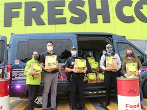 From left at Cram the Cruiser fundraising event for the Agape Centre on Friday are Jordan and Chris O'Brien (FreshCo franchise owners), CPS Const. Casey MacGregor, Justin Leslie (CPS auxiliary) and Pauline Brown (Agape Centre operational manager) Photo on Friday, Sept. 26, in Cornwall, Ont. Todd Hambleton/Cornwall Standard-Freeholder/Postmedia Network