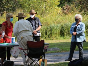 Conservators and visitors at one of the petition tables near the Cooper Marsh Entrance. Photo on Saturday, September 26, 2020, in South Lancaster, Ont. Todd Hambleton/Cornwall Standard-Freeholder/Postmedia Network