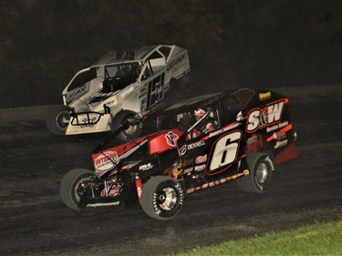 Eventual race winner Mat Williamson going low to move past Cornwall's Brian McDonald during the Modified feature on Sunday night at Cornwall Motor Speedway.Rick Young Photo//Cornwall Standard-Freeholder/Postmedia Network