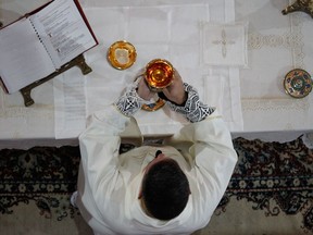 Moment of the consecration of the bread and the sacred wine during the Catholic liturgy.