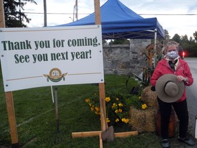 A fair volunteer at the exit of the 209th Williamstown Fair, held as a drive-through event on Saturday September 5, 2020 in Williamstown, Ont. Joshua Santos/Cornwall Standard-Freeholder/Postmedia Network