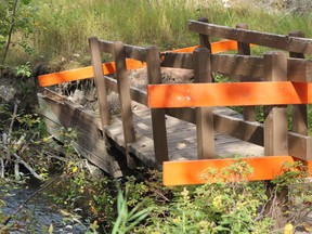 The Riverfront Bridge sits closed off and washed out on September 20. Patrick Gibson/Cochrane Times