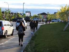 Grade 9 students at Ecole McTavish walk to their entrance for the first day of school on Tuesday, September 1, 2020. Laura Beamish/Fort McMurray Today/Postmedia Network
