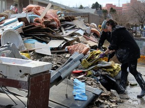 Items are thrown out because of water damage from the flood at a home in downton Fort McMurray, Alta. on Saturday, May 2, 2020. Laura Beamish/Fort McMurray Today/Postmedia Network