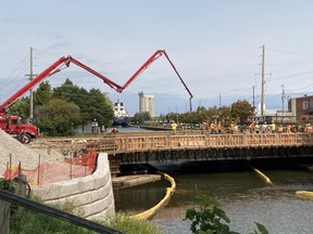 Tuesday was another big day for Owen Sound's 10th Street bridge replacement project. Using a concrete pump truck and 33 to 35 truckloads of liquid cement, workers created the deck for the new bridge. The deck is made up of about five kilometres of rebar and roughly 300 cubic metres of cement, according to the city. DENIS LANGLOIS