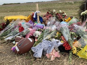 A mountain of footballs, flowers, teddy bears, and hand-written notes have been placed near the crash site where two teens from Sherwood Park were killed on Thursday, Sept. 17.  Photo by Lindsay Morey/ Postmedia