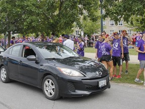 First-year Queen's University engineering students participate in the pickup and blitz of 15,000 boxes of nuts with local Rotarians for the 55th annual Rotary Nut Drive at Tindall Field in September 2019. (Julia McKay/The Whig-Standard)