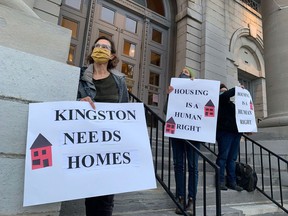 Housing advocates stand on the steps of Kingston City Hall during a housing protest on Sept. 15.