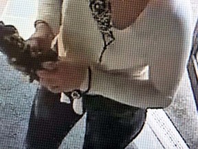 Kingston Police are looking for this woman in connection to a report of mailboxes being broken into on Aug. 17. (Supplied Photo)