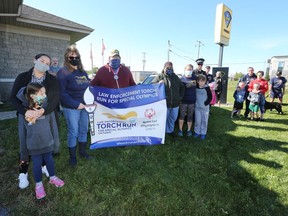 A small group of Special Olympics Ontario supporters gathered at the Lennox and Addington County Ontario Provincial Police detachment in Napanee on Saturday to complete five kilometres together for the 2020 Virtual Law Enforcement Torch Run. (Meghan Balogh/The Whig-Standard)