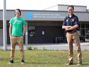 Jon Oosterman of Pathways to Education and Paul Elsley, the Rotary Club of Kingston president, stand outside the Kingston Community Health Centres building on Weller Avenue on Tuesday. (Meghan Balogh/The Whig-Standard)